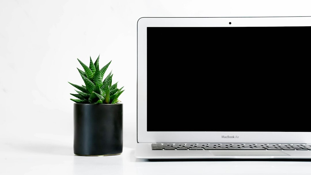 Person analyzing financial growth charts on a laptop screen