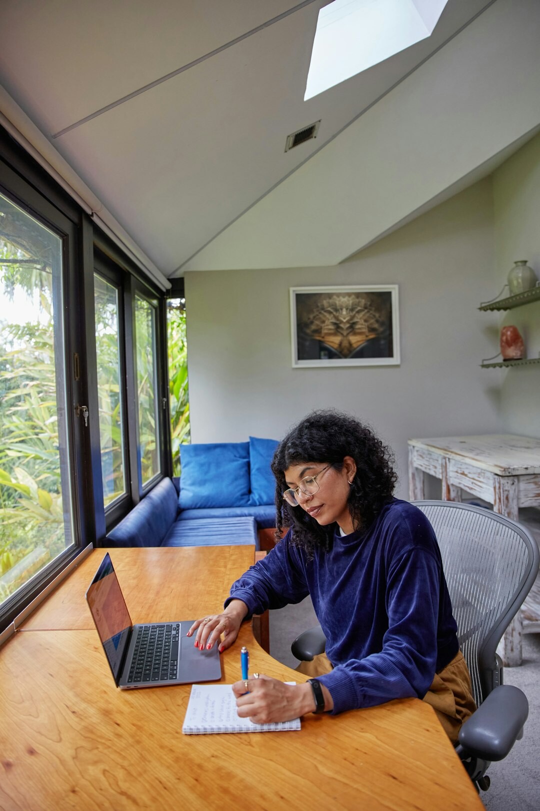 person budgeting at home desk