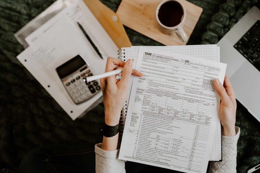 person budgeting at home desk